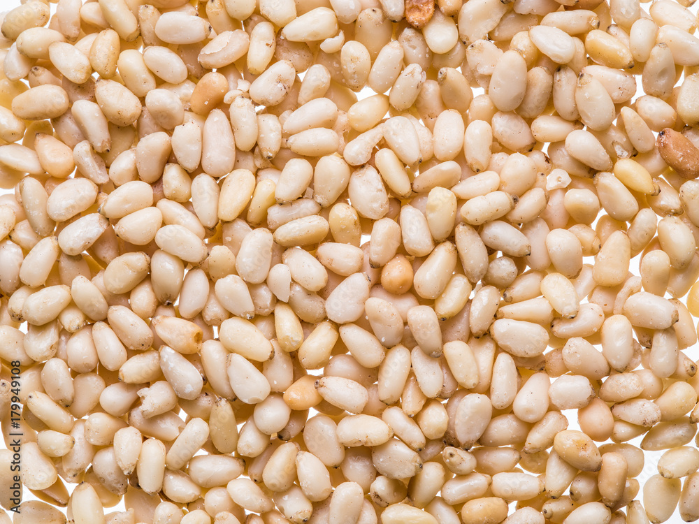 Seeds of pines or pine nuts on the white background. Seeds of pines or pine nuts on the white background.