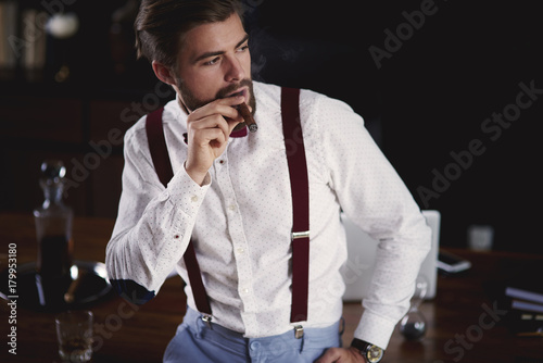 Businessman smoking a cuban cigar