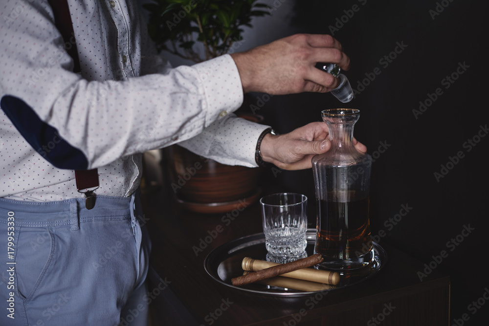 Business person drinking whisky at his office