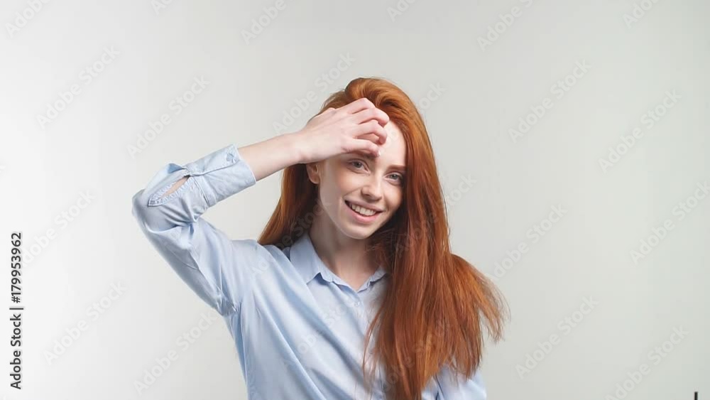 Portrait of pretty redhead girl smiling looking at camera. Slow motion. Portrait of pretty redhead girl smiling looking at camera. Slow motion.
