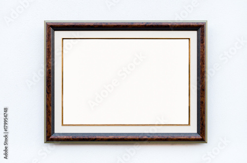 Ornate picture frame on the white wall in Art Gallery, Blank White Isolated Clipping Path