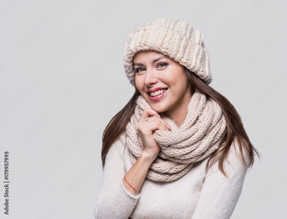 Beautiful woman winter portrait. Smiling girl wearing warm clothes Beautiful woman winter portrait. Smiling girl wearing warm clothes
