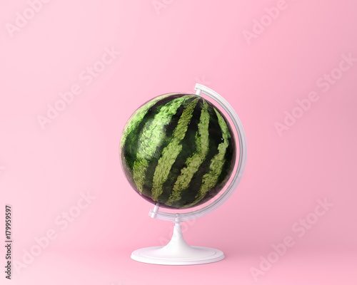 Globe sphere orb watermelon concept on pastel pink background. minimal idea food and fruit concept. An idea creative to produce work within an advertising marketing communications or artwork design.