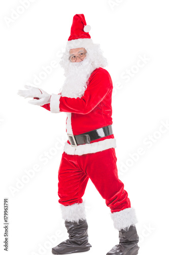 Happy merry Christmas Santa Claus pointing holding Gift Box with Isolated on white background.
