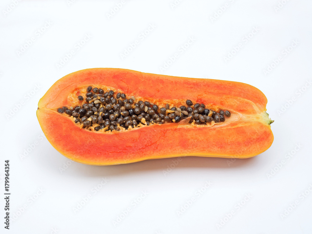 Papaya Cut in Half with Seeds on White Background Papaya Cut in Half with Seeds on White Background