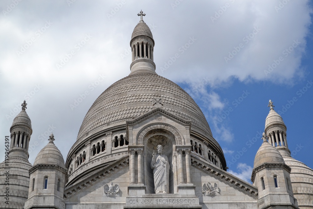 Majestic statue of Jesus blessing, French architectural detail of Sacred Heart Basilica, on Montmartre, in Paris Majestic statue of Jesus blessing, French architectural detail of Sacred Heart Basilica, on Montmartre, in Paris
