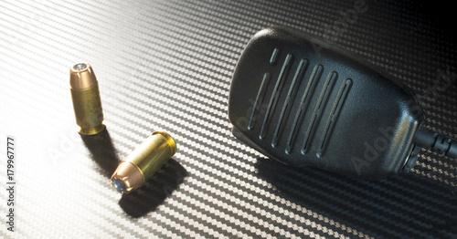 pistol bullets and microphone photo