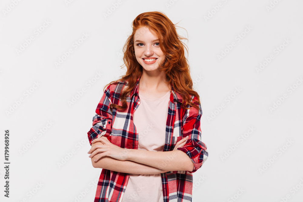 Happy attractive young redhead lady with arms crossed. Looking camera. Happy attractive young redhead lady with arms crossed. Looking camera.