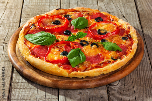 pizza on wooden plate