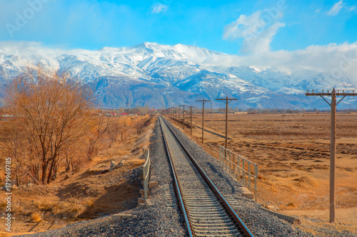 Deep Winter Train Tracks and Mountains