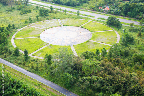 Bird eye view of trail in an open green field
