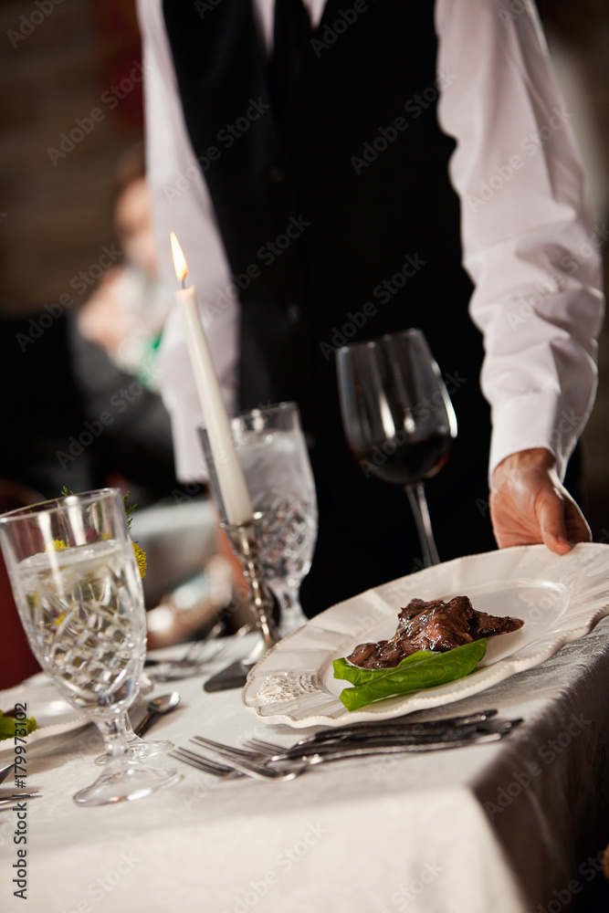 Restaurant: Server Puts Plate On Table