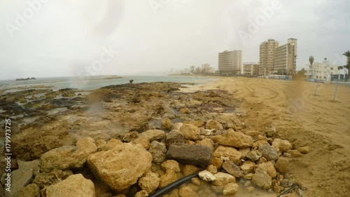 forbidden beach in closed ghost town Varosha under rain in North Cyprus