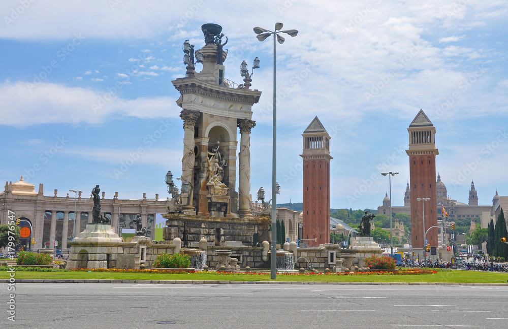 Obraz premium Spain square in Barcelona, with a fountain and towers