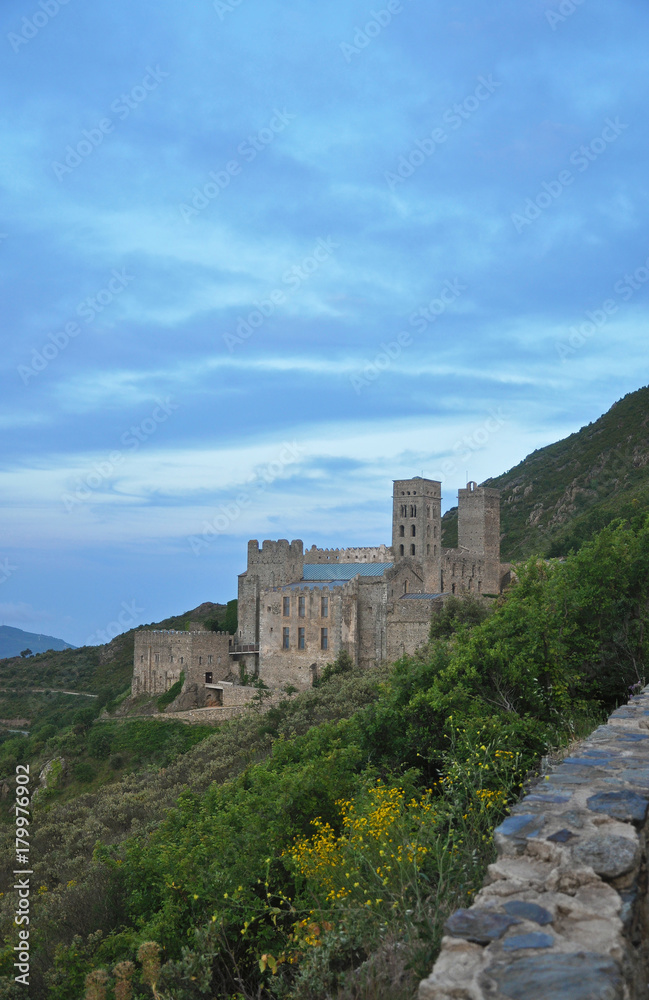 Evening landscapes of Spain - mountains, roads and medieval monastery Sant Pere de Rodes