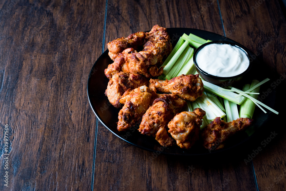 Fototapeta premium Buffalo Wings with Dip Sauce and Leek