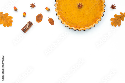 Festive homemade pumpkin pie on white background. Flat lay, top view. Thanksgiving Day