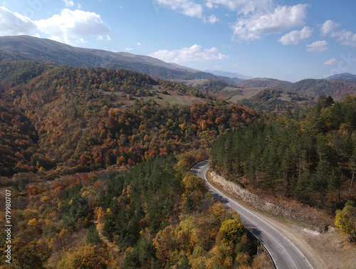 Aerial drone shot of Serpentine, Mountain Highway in the middle of Forest © Ruben