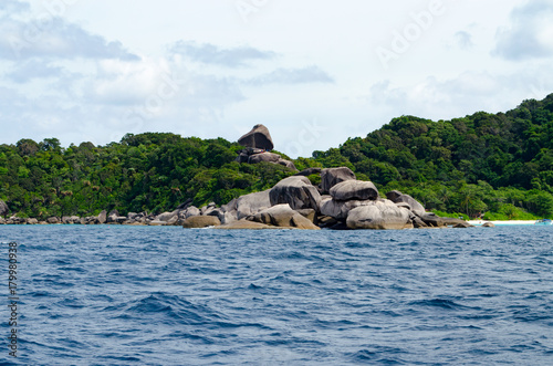 Beautiful Seascape with Focus on the Forest on the Mountain Rock in the Sea. 
