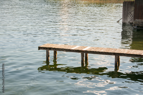 boardwalk with calm lake © Redfox1980