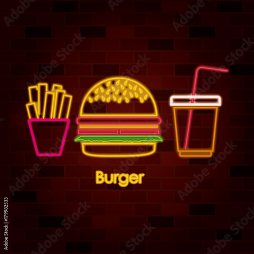 french fries burger and drink on neon sign on brick wall