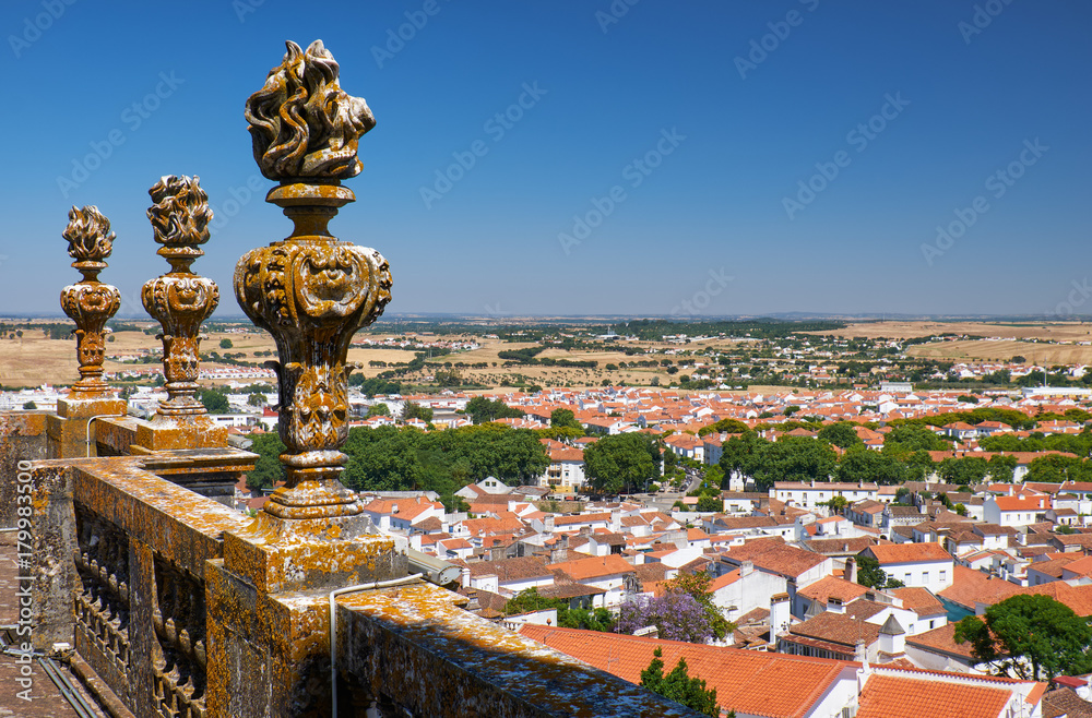 Decorative stone torches on the balcony of Evora Cathedral (Se). Evora. Portugal