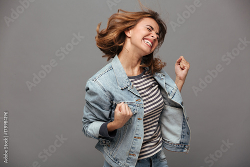Obraz na plátně Portrait of a satisfied cheerful teenage girl
