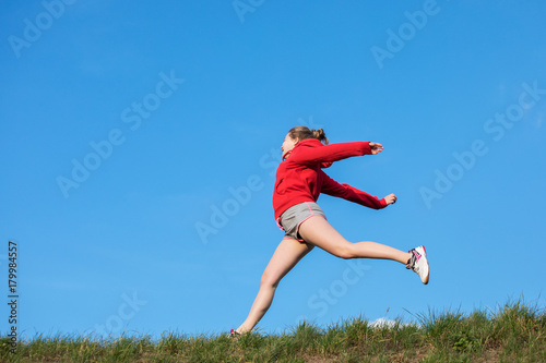 athletic girl jumping 