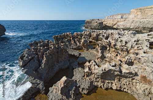 Coast of the island of Gozo (Malta) with karst pools photo