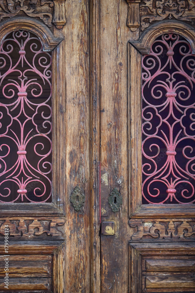 Old door with forged ornament. Details. Lisbon, Portugal Old door with forged ornament. Details. Lisbon, Portugal
