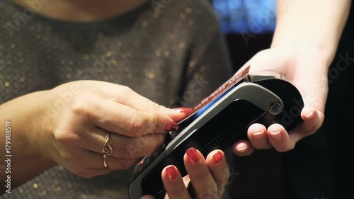 Close up of customer paying by credit card
