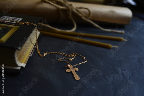gold cross and a Bible . symbols of faith and spirituality