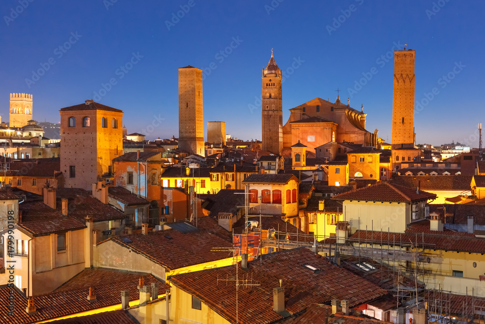 Aerial view of Bologna Cathedral and towers towering above of the roofs of Old Town in medieval city Bologna during evening blue hour, Emilia-Romagna, Italy