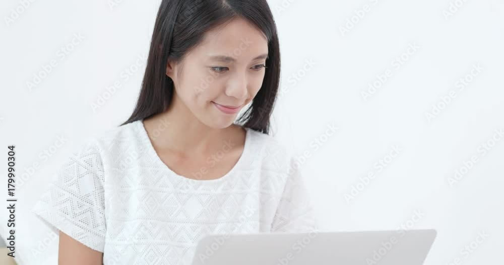 Woman using laptop computer for online shopping