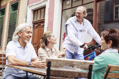 Germany, Heidelberg, senior friends in a street cafe