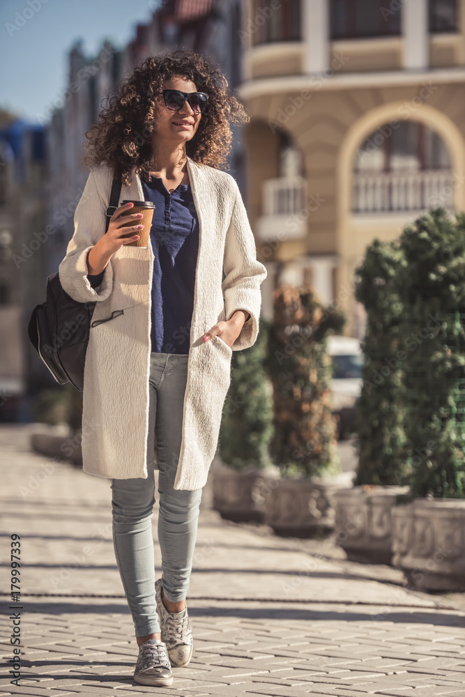 Fototapeta premium Young woman in city