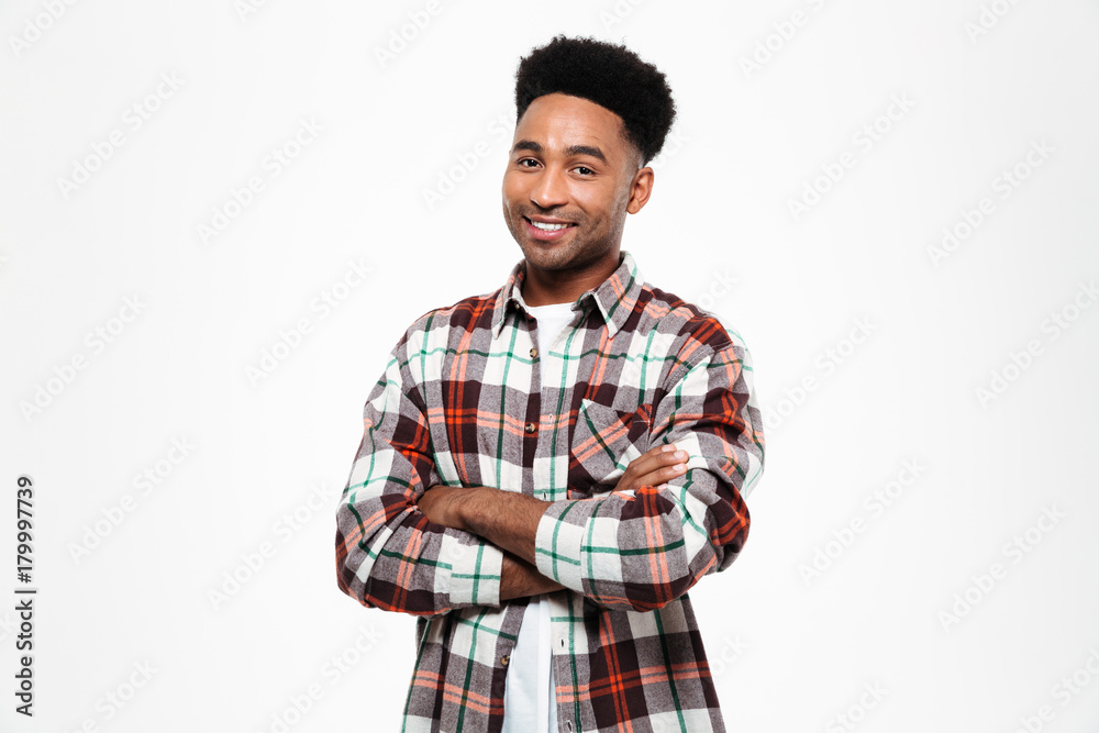 Portrait of a smiling african man dressed in plaid shirt Portrait of a smiling african man dressed in plaid shirt