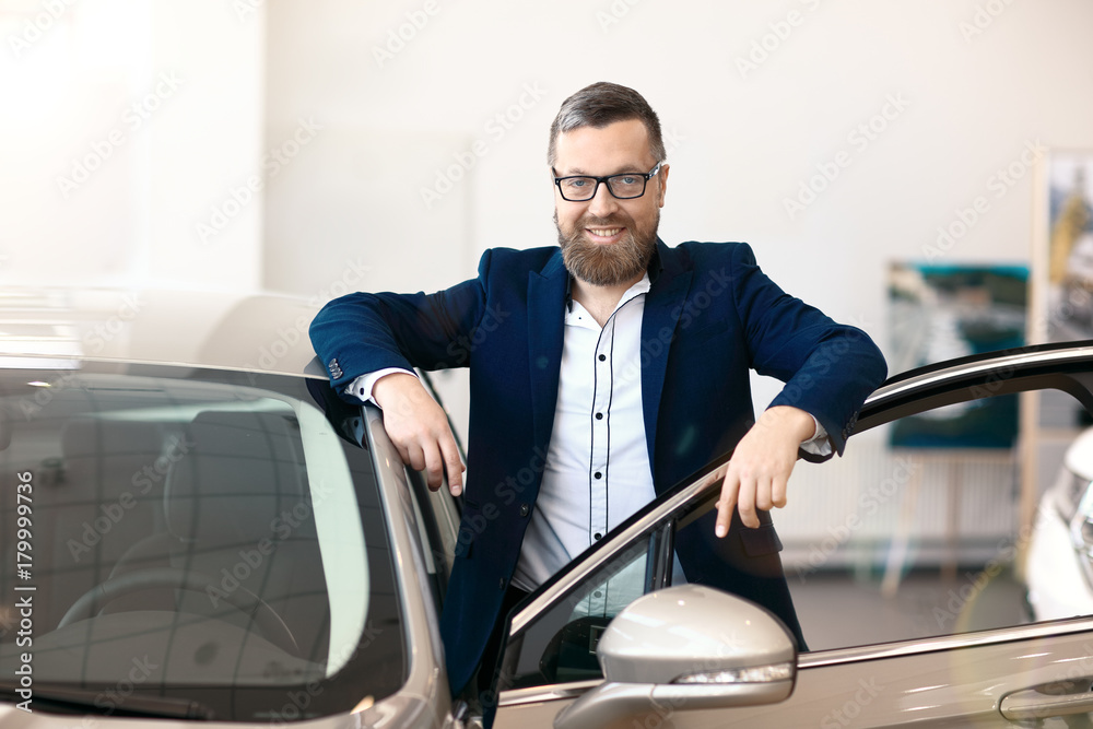 Happy buyer in car dealership Happy buyer in car dealership