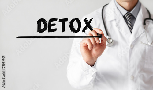 Doctor writing word Detox with marker, Medical concept photo