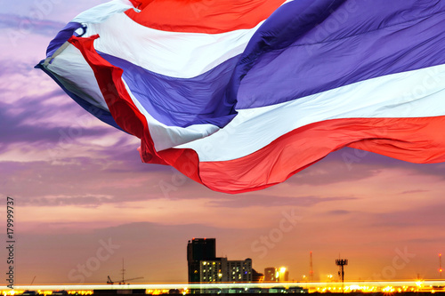 Foto Waving flag of Thailand on twilight sky background