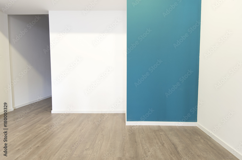 Empty room with walls and wooden parquet floor and door Empty room with walls and wooden parquet floor and door