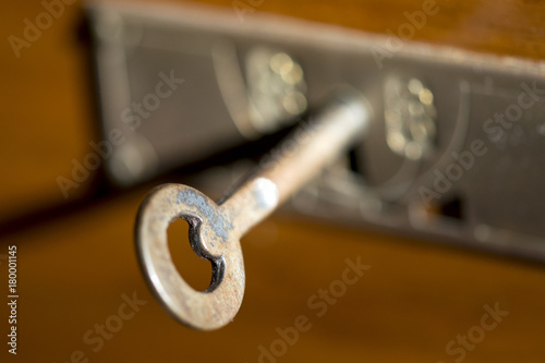 brass key in a keyhole