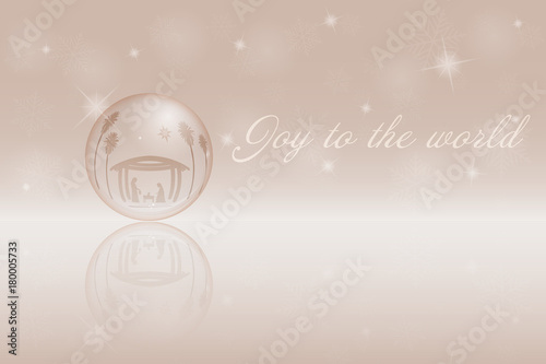 Christmas time. Christmas bowl Nativity scene with Mary, Joseph and baby Jesus in Christmas landscape. Text: Joy to the world.