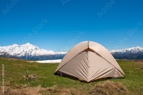 Tent close-up, on the green mountain meadow