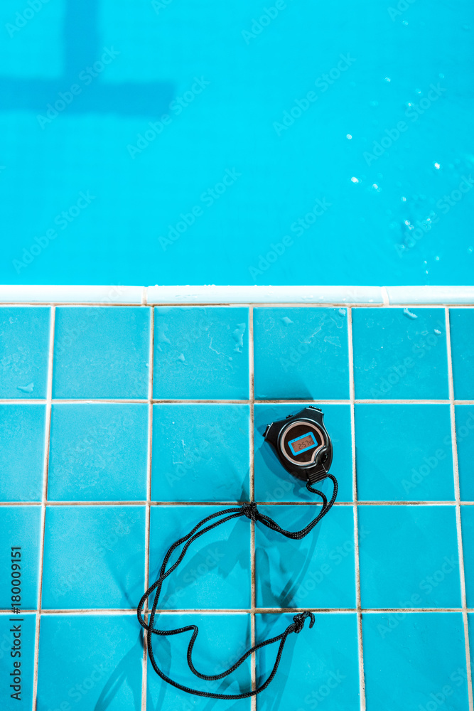 stopwatch at competition swimming pool