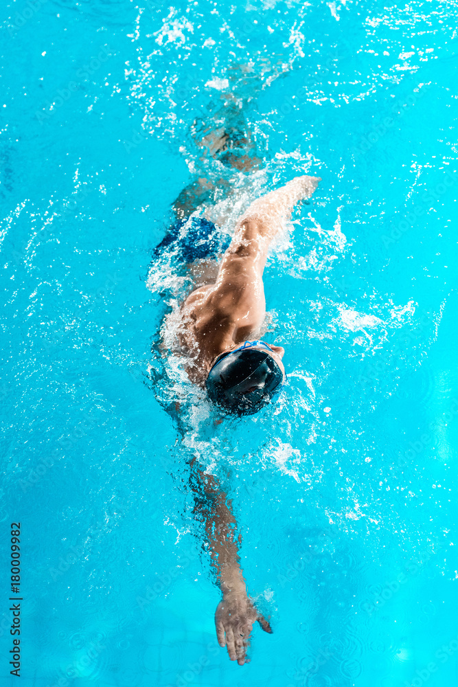 swimmer swimming in pool