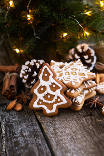 Christmas Gingerbread on a wooden table with decorations.Copy space