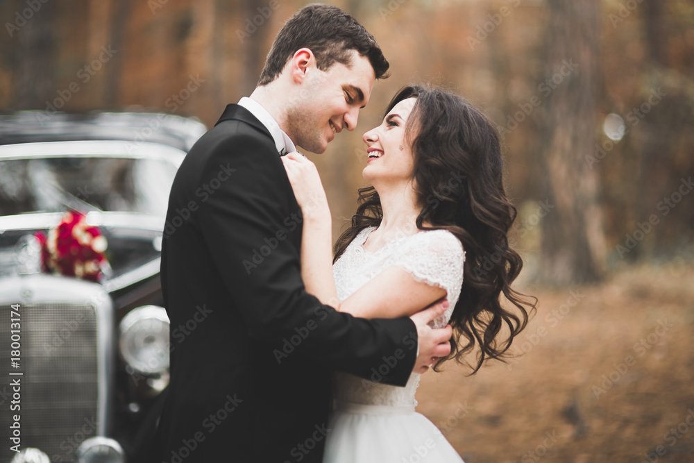 Just married happy couple in the retro car on their wedding Just married happy couple in the retro car on their wedding