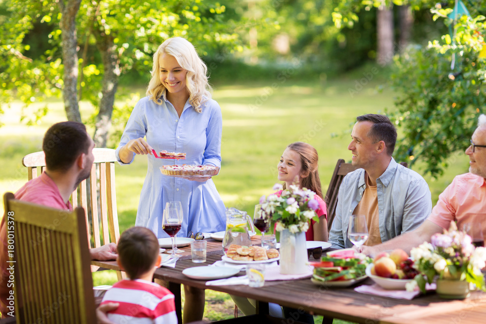 happy family having dinner or summer garden party happy family having dinner or summer garden party