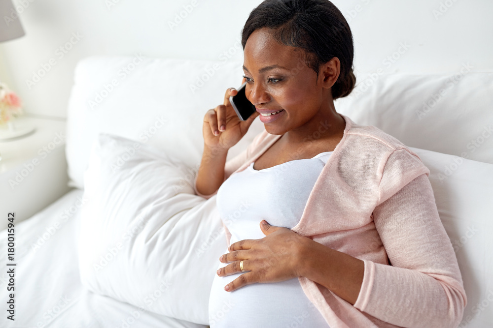 happy pregnant woman calling on smartphone at home happy pregnant woman calling on smartphone at home